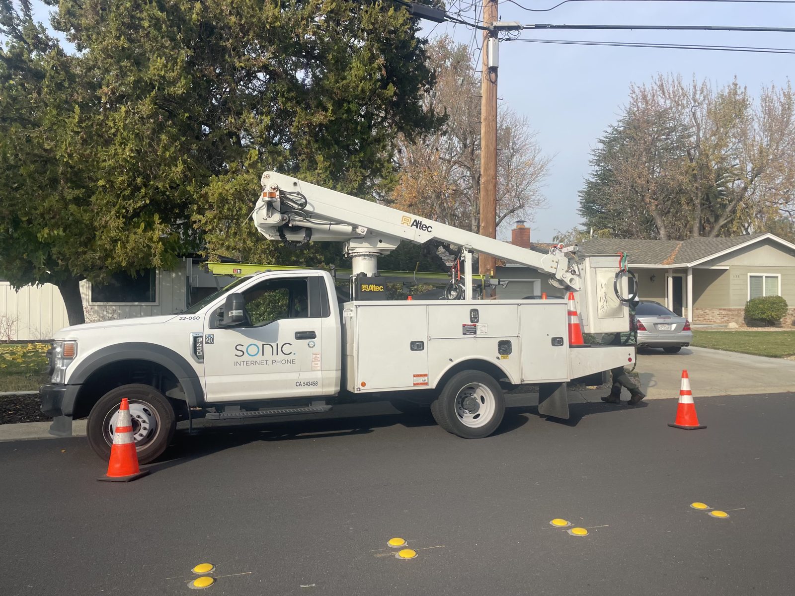Sonic Internet + Phone service truck parked on a residential street during a fiber install